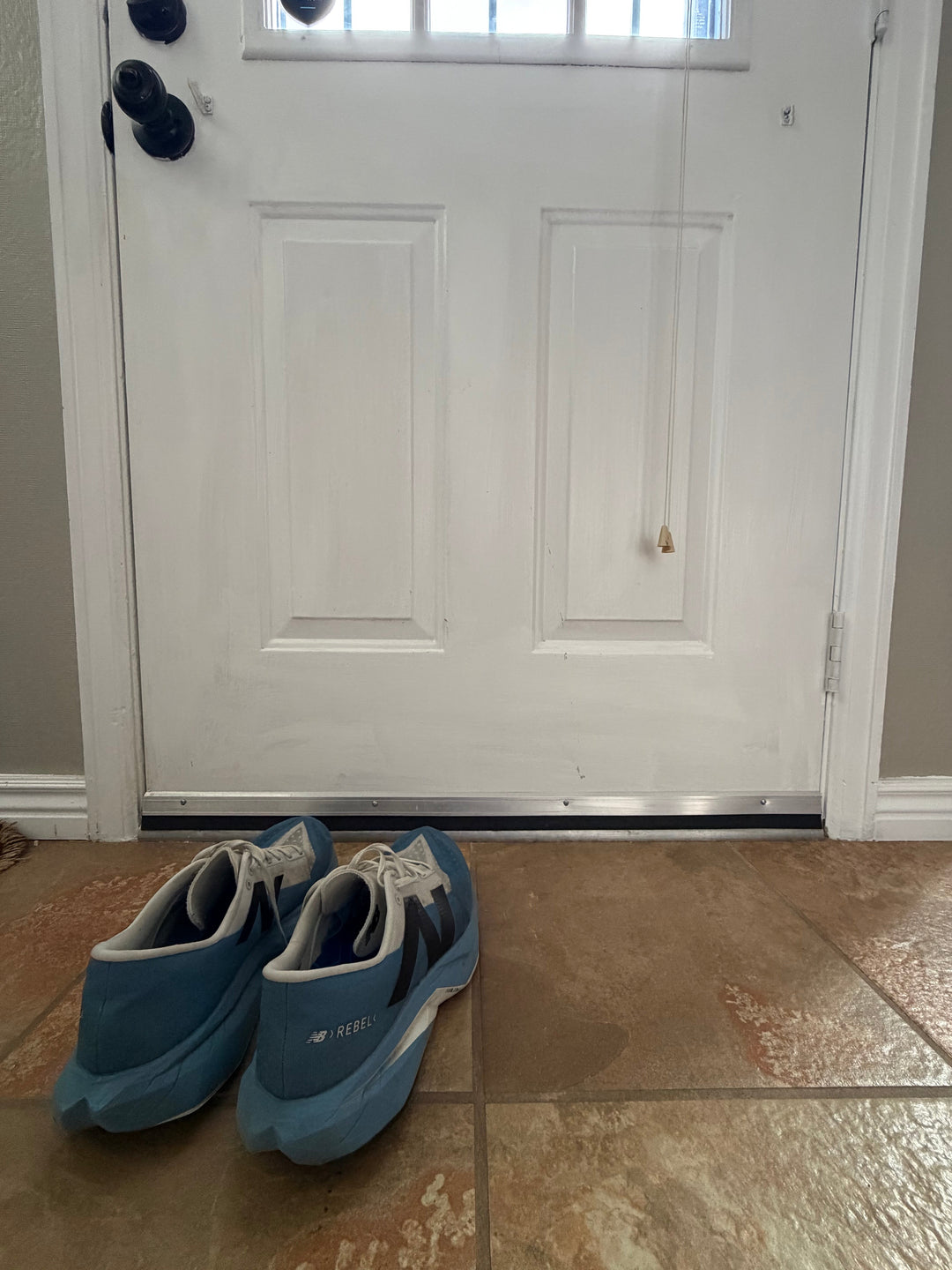 Running shoes by the door before a training run