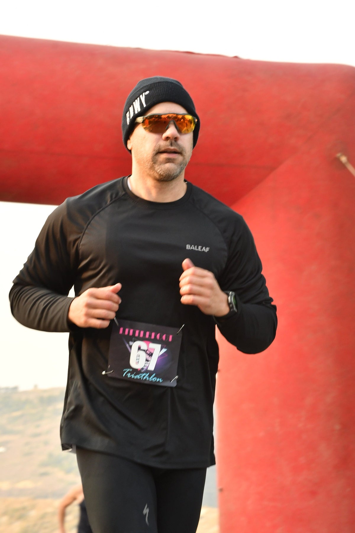 Dan Caron, co-founder of RNWY, running during a local sprint triathlon